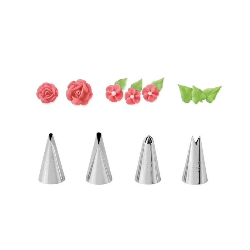 Set of four metal icing nozzles with decorative flowers and leaves on a white background