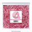 Pink shredded paper in a clear package with a label on a white background