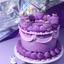 Purple cake with decorative elements on a reflective surface