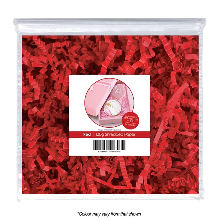 Red shredded paper in a clear bag with a label on a white background