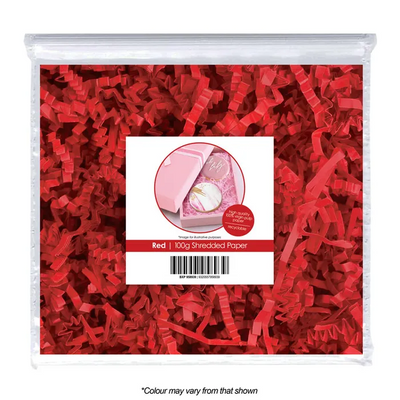 Red shredded paper in a clear bag with a label on a white background