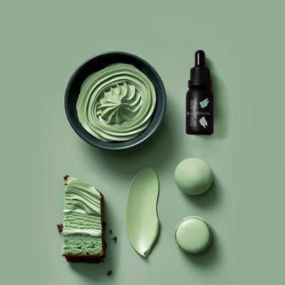 Sage Green-themed icing products including a bowl, cake, and bottle on a green background