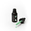 Black bottle of Sprinks gel color with a dropper filled with green liquid on a white background