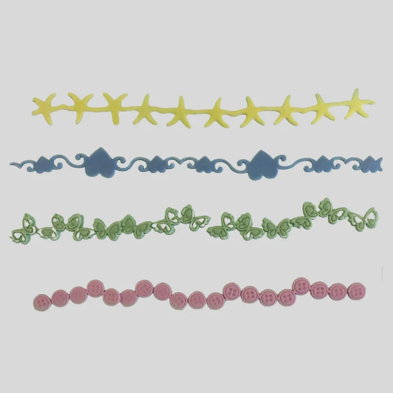 Set of decorative fondant border designs in yellow, blue, green, and pink on a white background