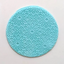 A round turquoise blue fondant plaque with an intricate floral mandala embossed pattern, shown on a plain off-white background.