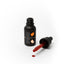 Black bottle of Sprinks gel color with a dropper on a white background