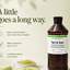 A bottle of Loramirac flavor booster labeled Tart & Sour fruit flavor enhancer, shown on a light cream background with marketing text and small food props at the bottom.