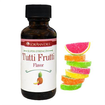 Bottle of LorAnn Oils Super-Strength Tutti Frutti Flavor with colorful gummy candy slices on a white background