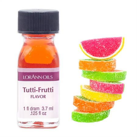 A bottle of Lorân Oils Tutti-Frutti Flavour essential oil next to a stack of colorful fruit slice gummy candies on a white background.