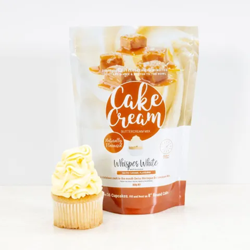 Bag of Cake Cream Whisper White Salted Caramel buttercream mix with a frosted cupcake on a white background