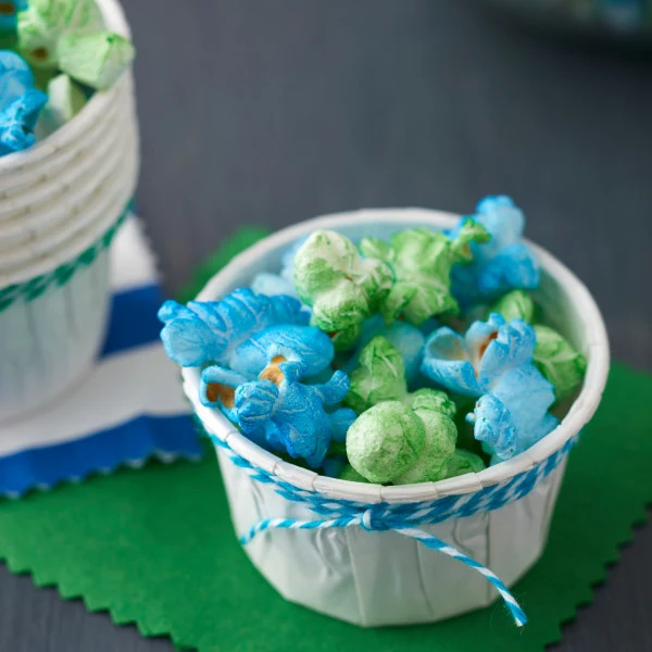 White Wilton nut cups filled with coloured popcorn