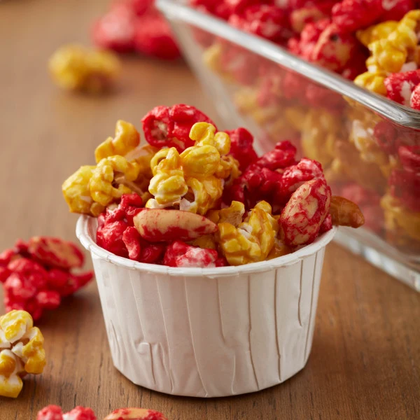 White Wilton nut cups filled with coloured popcorn