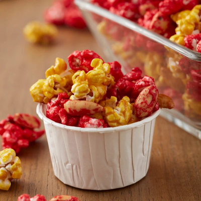 White Wilton nut cups filled with coloured popcorn