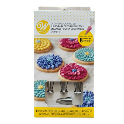 Wilton cookie decorating set packaging with decorated cookies on a white background
