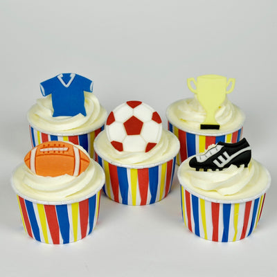 Cupcakes with sports themed toppers