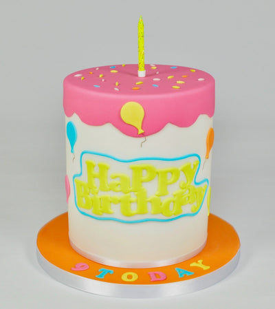 Happy Birthday cake in bright neon colours