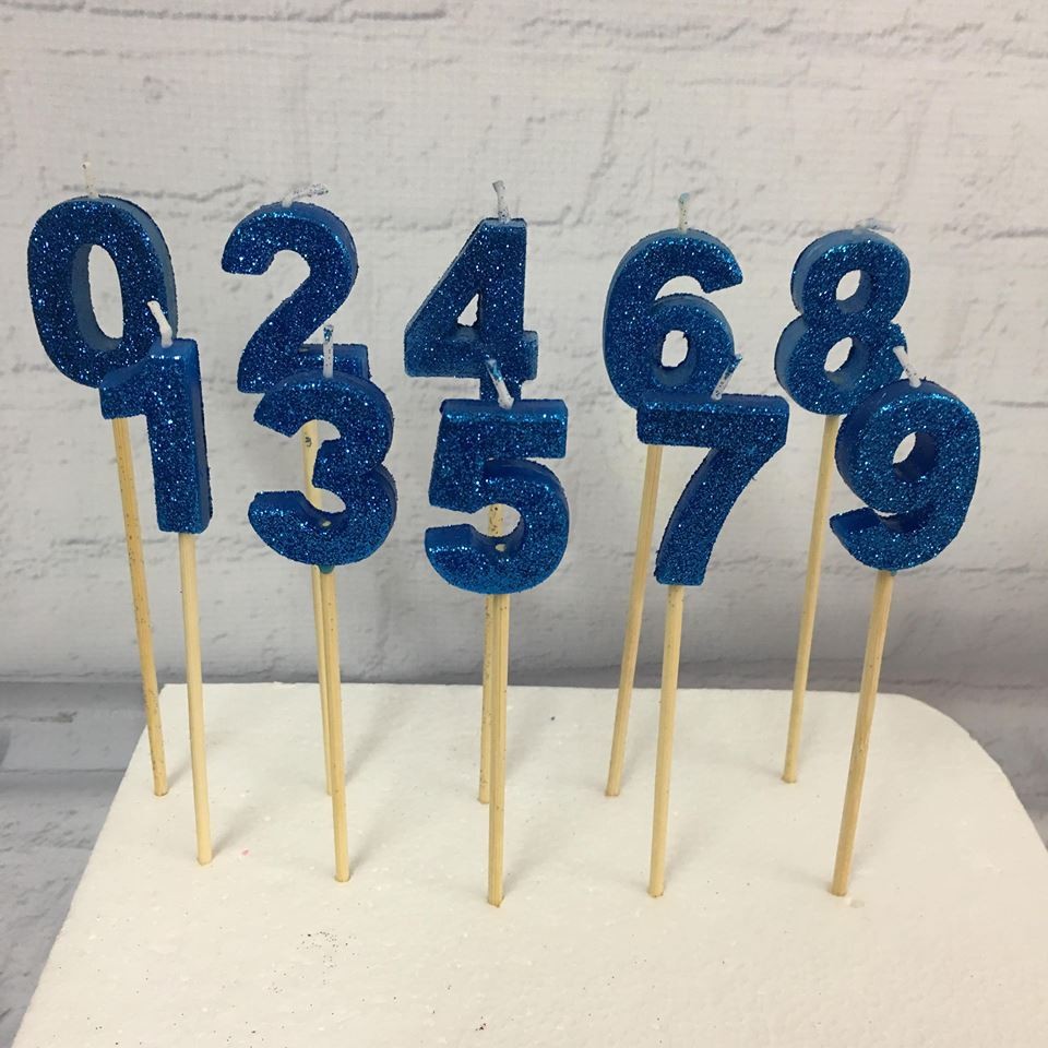 Sparkly blue age number candles with wooden picks