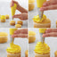 step by step instructional photo showing how to pipe a cupcake swirl using tip 1M