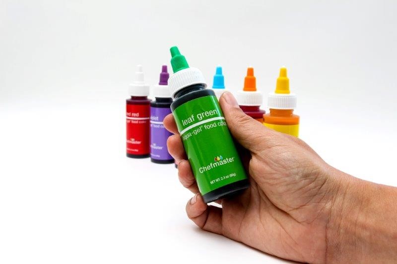 Group photo of large bottles of Chemfaster food colouring