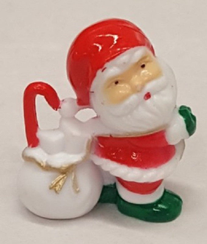 Small plastic Santa figurine cake topper