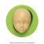 A green silicone mould in the shape of a child's face, designed for creating figurines or decorations.
