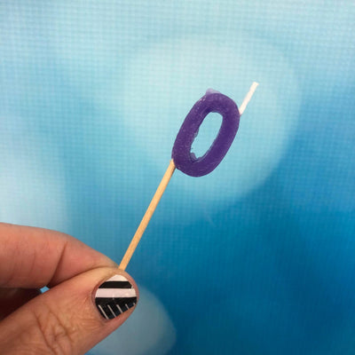 Alphabet or numeral candle on wooden pick Letter O or NUMBER 0 Purple