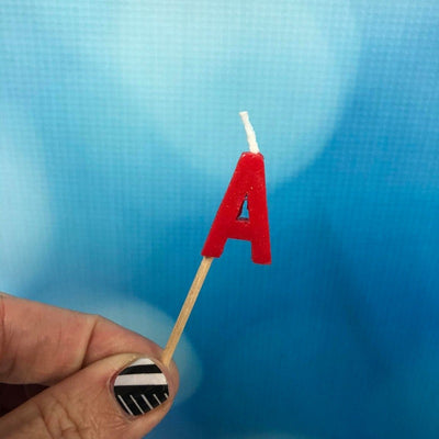 Alphabet or numeral candle on wooden pick Letter A Red