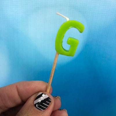 Alphabet or numeral candle on wooden pick Letter G Green
