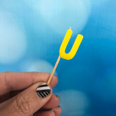 Alphabet or numeral candle on wooden pick Letter U Yellow