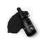 A black dropper bottle labeled 'SPRINKS BLACK GEL COLOUR' with a small amount of black gel food coloring visible next to it.