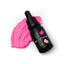 A bottle of SPRINKS hot pink gel colour placed next to a swatch of the product showing its vibrant pink color.