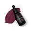 A bottle of SPRINKS gel food colouring in maroon (purple) colour, with a dropper, placed next to a swatch of the colour.