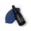 A bottle of SPRINKS navy blue gel colour placed on a surface with a swatch of the blue colour below.