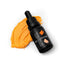 A bottle of SPRINKS Sunset Orange Gel Colour with a dropper, placed next to a small pile of orange-colored food gel.