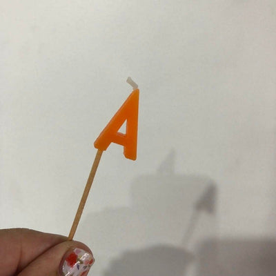 Alphabet or numeral candle on wooden pick Letter A Orange
