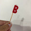 Alphabet or numeral candle on wooden pick Letter B Red