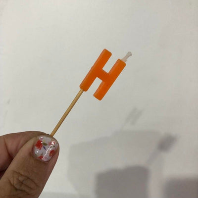 Alphabet or numeral candle on wooden pick Letter H Orange