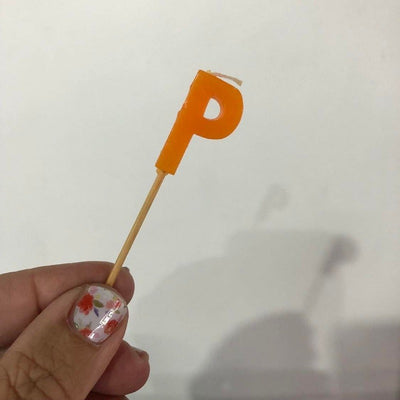 Alphabet or numeral candle on wooden pick Letter P Orange