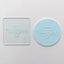 Clear acrylic debosser. That reads Happy Valentine's day. Alongside a fondant icing plaque showcasing its use.