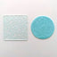 Clear acrylic Debosser with Easter design, alongside a fondant circle in teal as an example of use