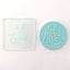 An Easter-themed embossing tool alongside a finished fondant plaque example. It reads Happy Easter, with a set of bunny ears above the words.