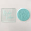 A clear debosser with the text 'Bride Tribe' embossed on it, placed over a light-colored surface. And an example of it used on fondant 