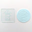 Clear acrylic debosser tool with Home Sweet Home. Alongside a blue fondant plaque showing how the end result works