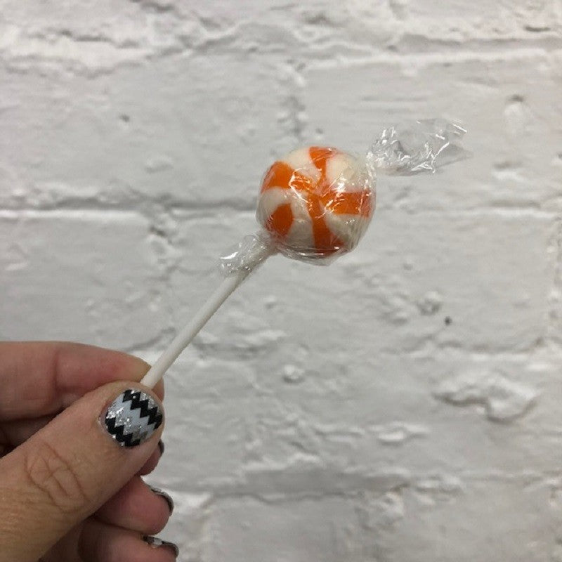 Orange and white round ball swirly lollipop