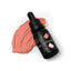 A 15ml dropper bottle of SPRINKS Blush Gel Colour, with the cap off and a few pink drops of food coloring shown beside it on a white surface.