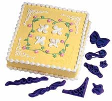 Stamp set Imprint curlicues and scrolls in to your icing